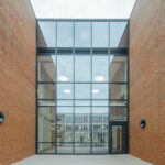 Glass entrance to new STEM building - Speller Metcalfe